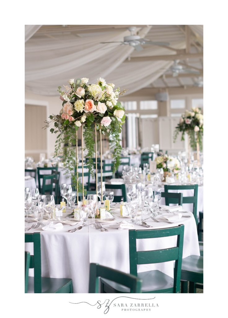 tall floral centerpieces with white and pink flowers at The Dunes Club wedding