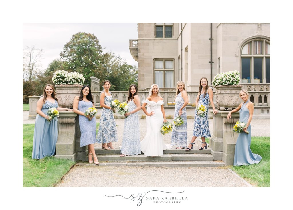 bride and bridesmaids pose on steps at Ochre Court 