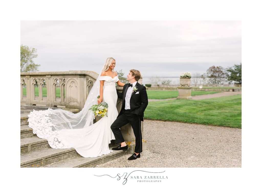 bride and groom walk down steps together at Ochre Court