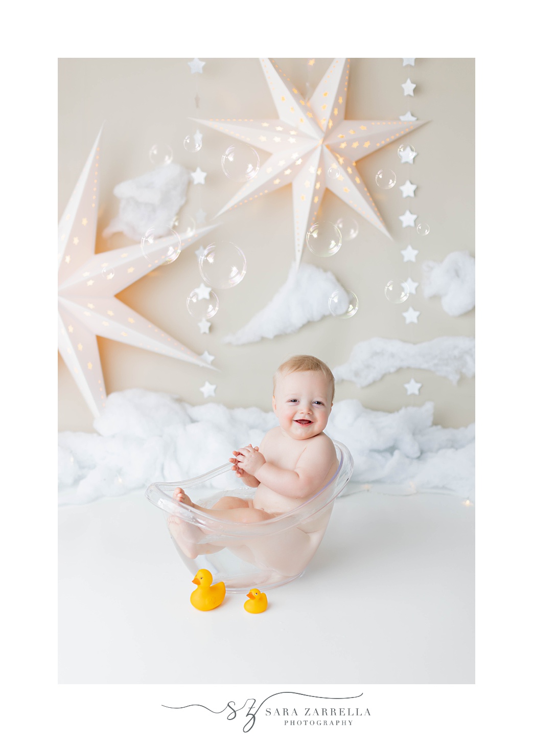 baby plays in tub during cake smash with RI family photographer Sara Zarrella Photography 