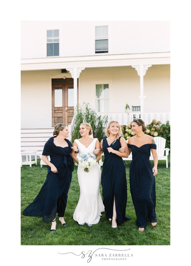 bridesmaids smile at bride outside the Spring House Hotel