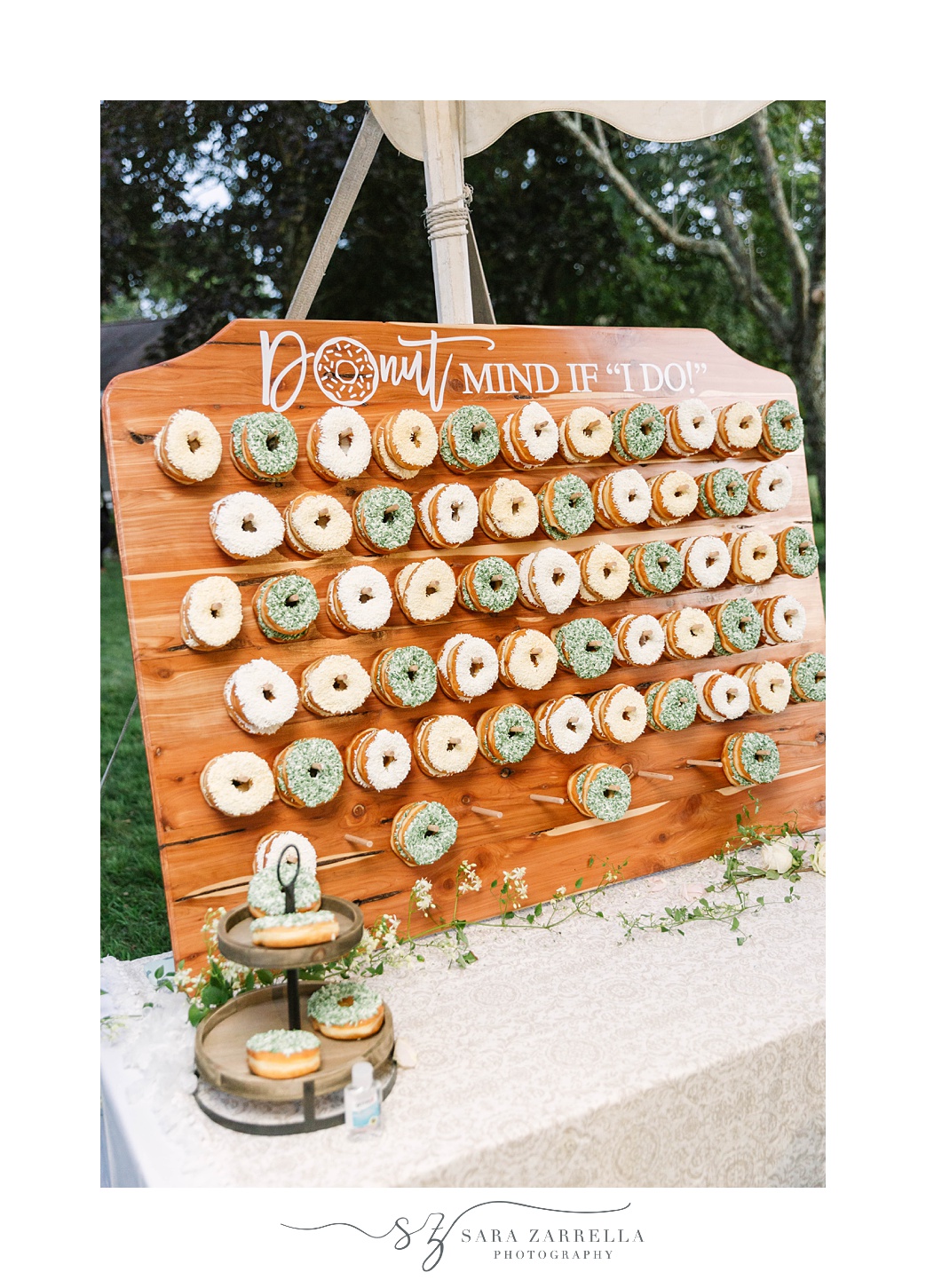 donut wall during whimsical garden wedding reception under tent