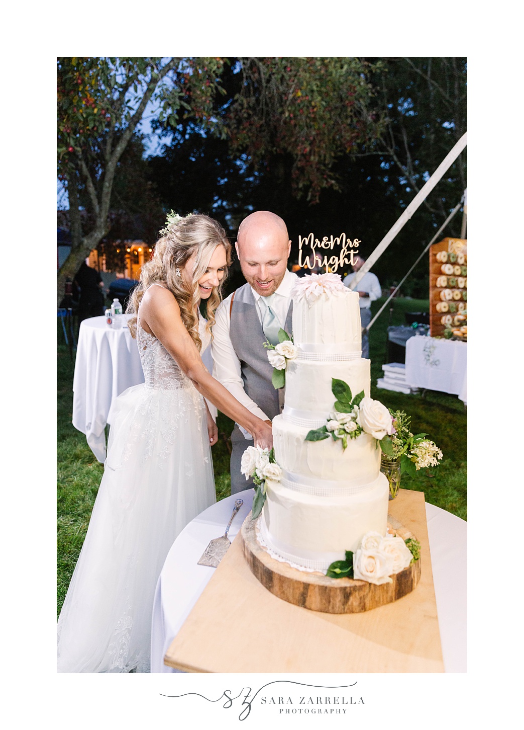 newlyweds cut wedding cake during RI wedding reception 