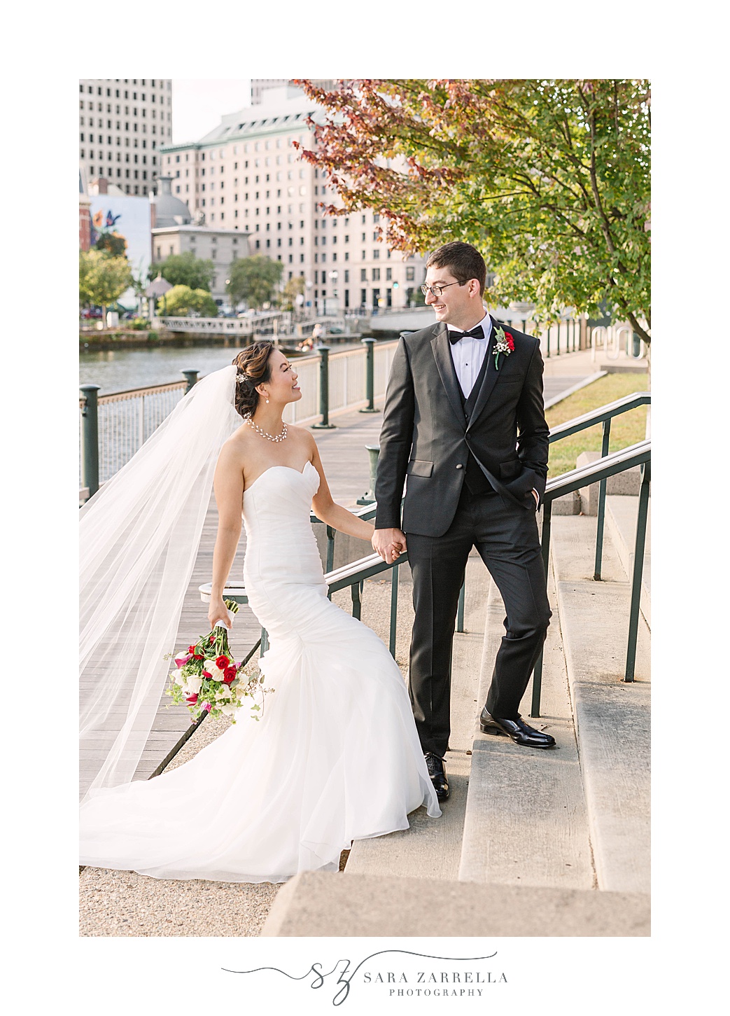 bride and groom walk up the stairs in Downtown Providence RI