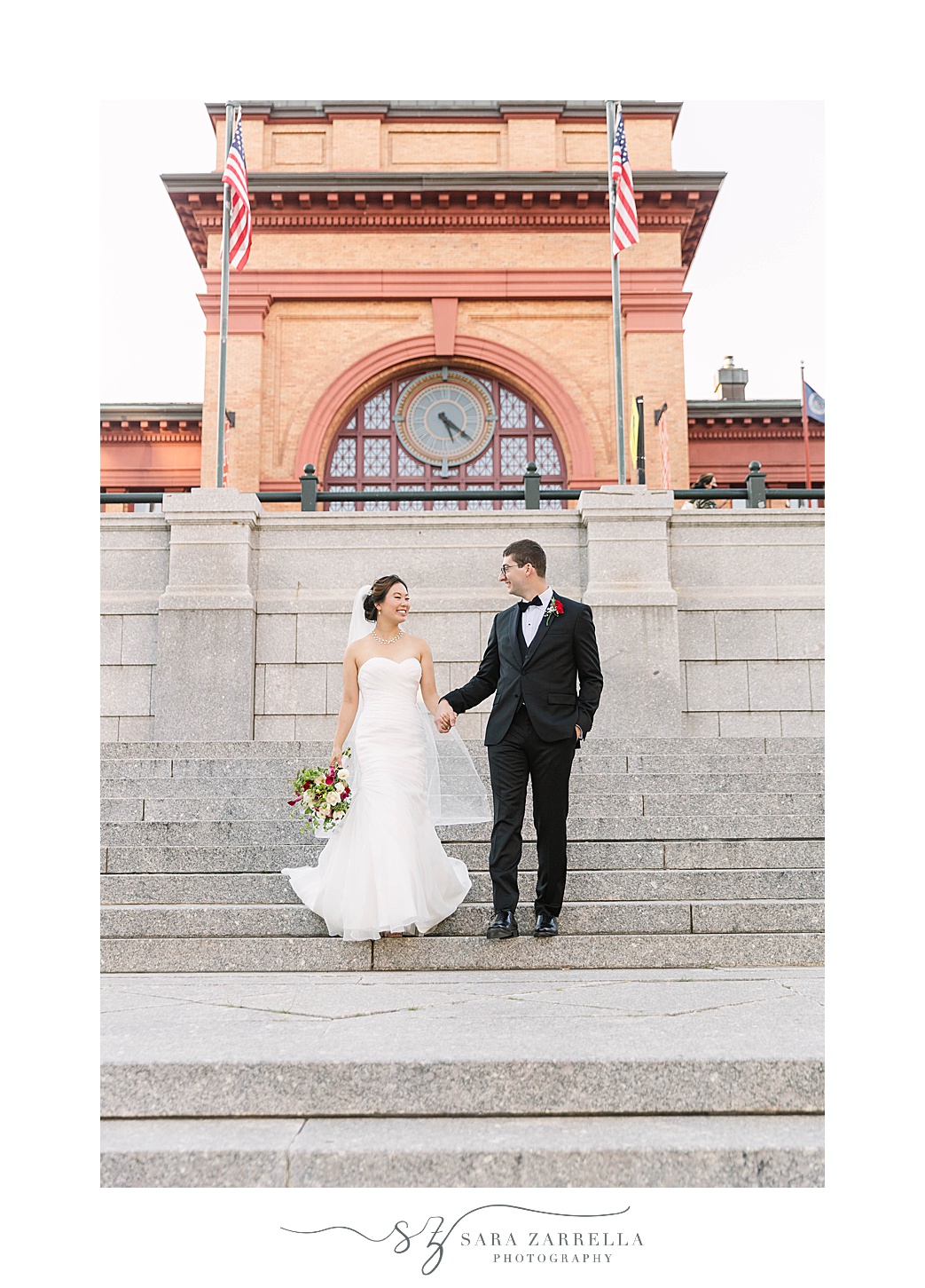 newlyweds walk down steps in Downtown Providence
