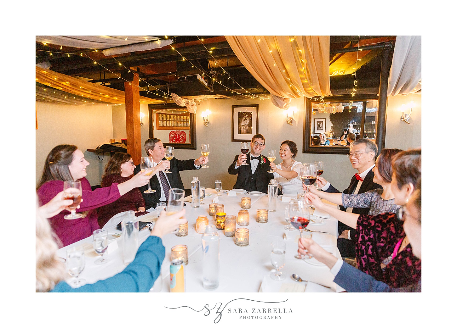 couple toasts wedding day with guests in Downtown Providence