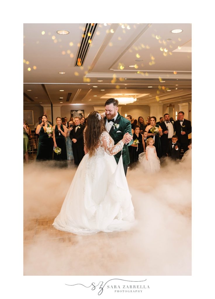 bride and groom dance with fog at Hotel Viking