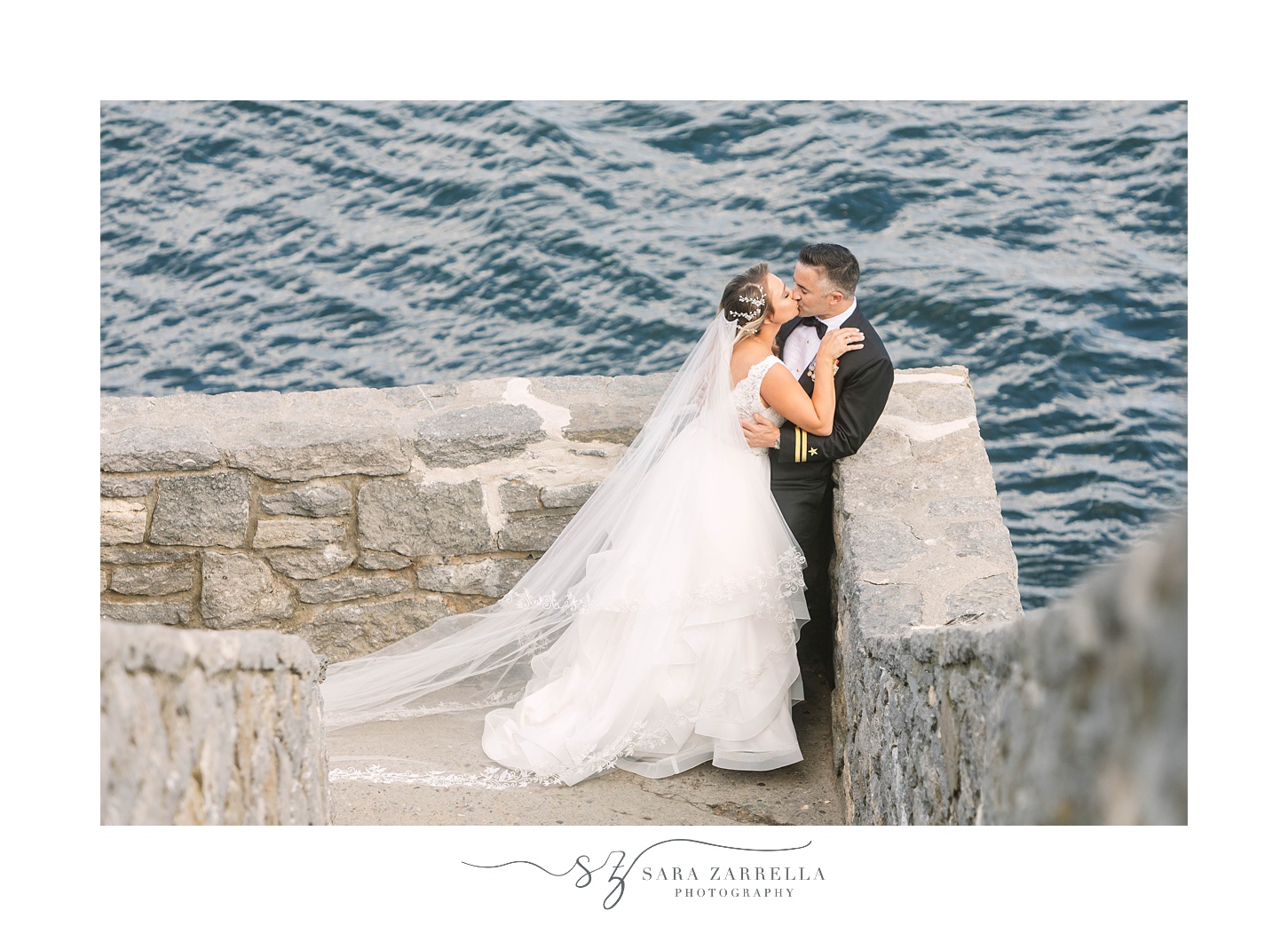 bride and groom kiss on stone staircase 