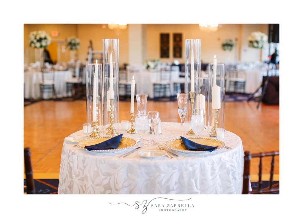 sweetheart table with gold chargers and navy napkins at the Newport Navy Officers’ Club