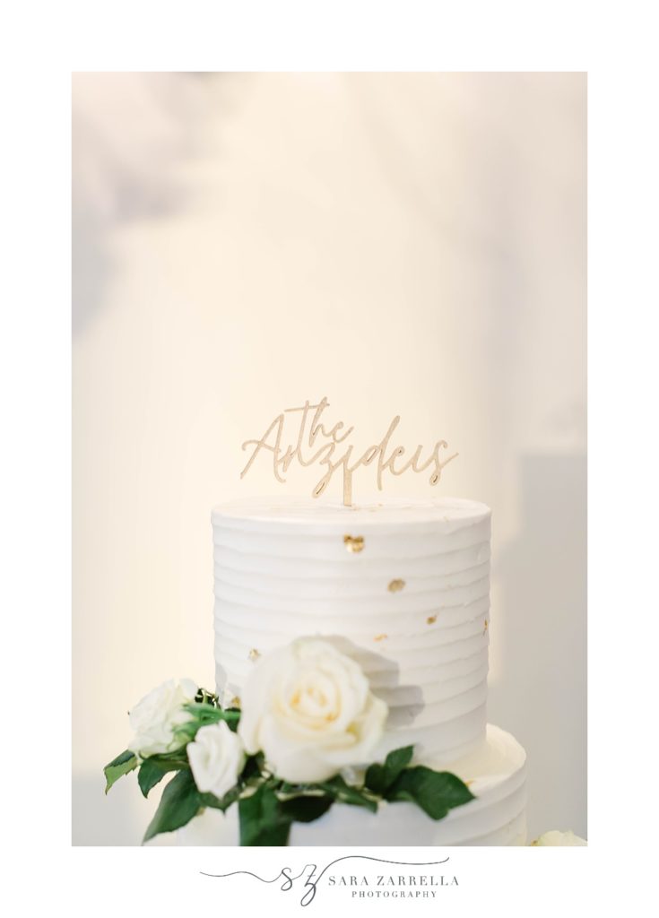wedding cake with gold flecks and topper 