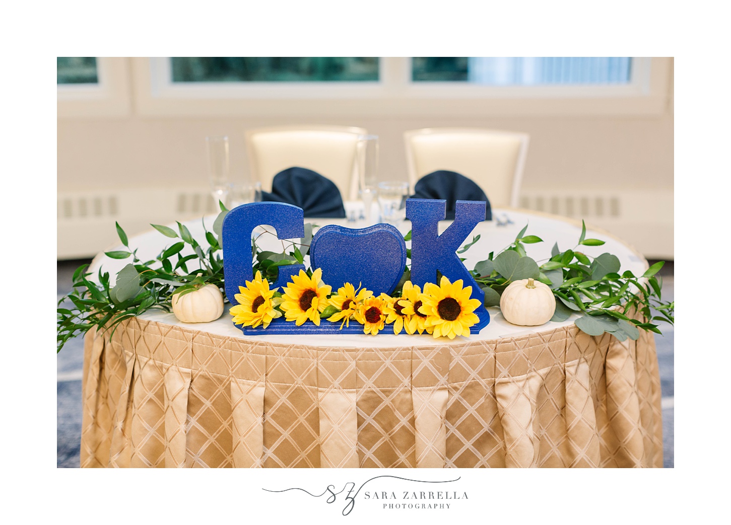 sweetheart table with blue letters and sunflowers 