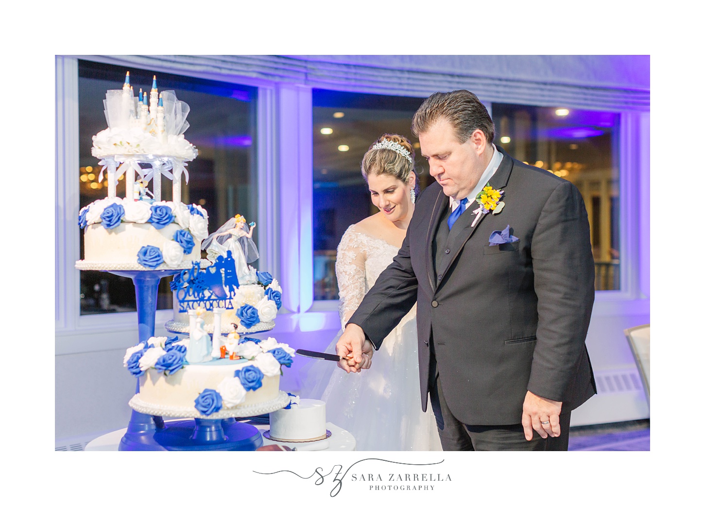 bride and groom cut wedding cake during North Kingstown RI wedding reception