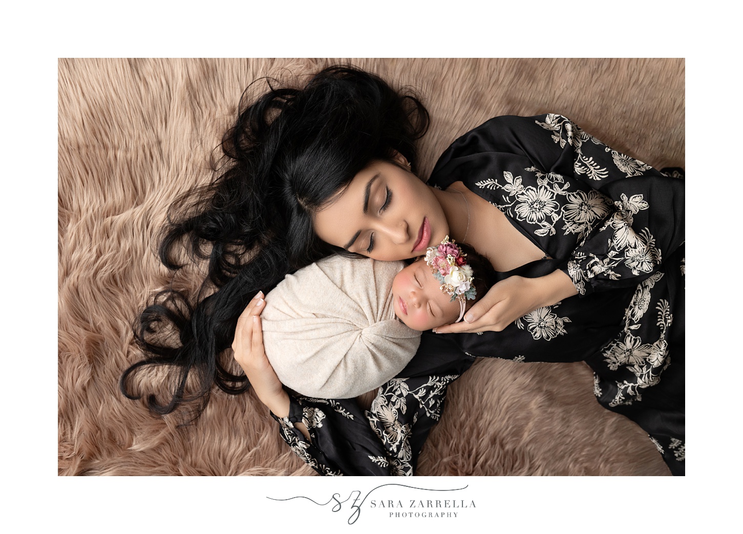 mother hugs baby during newborn portraits with Sara Zarrella Photography