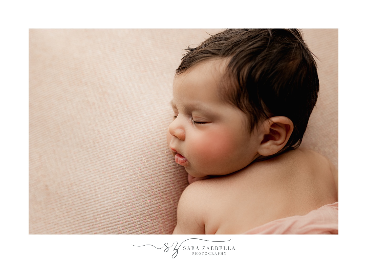 baby girl sleeps during newborn portraits 