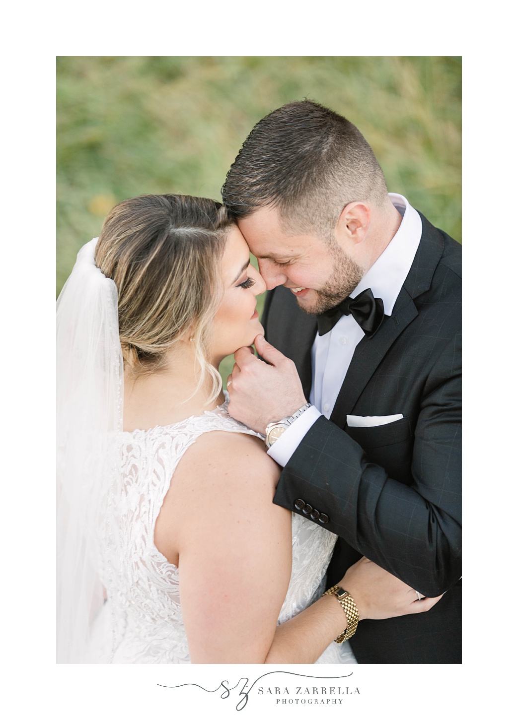 bride and groom hug closely during RI wedding portraits 