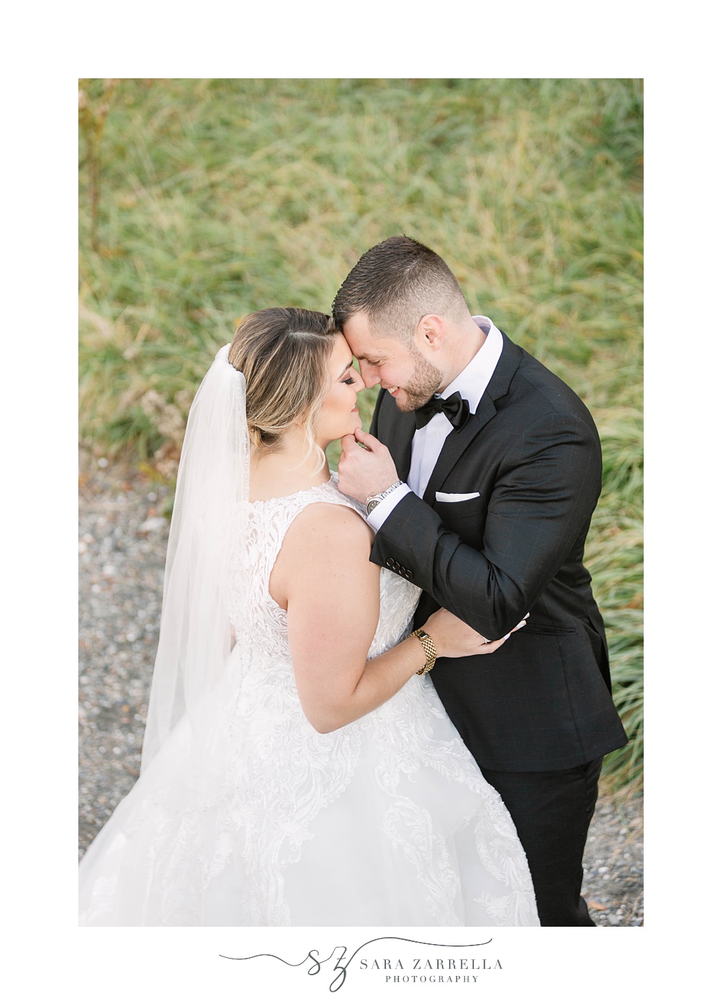 bride and groom stand together in grass at Glen Manor House