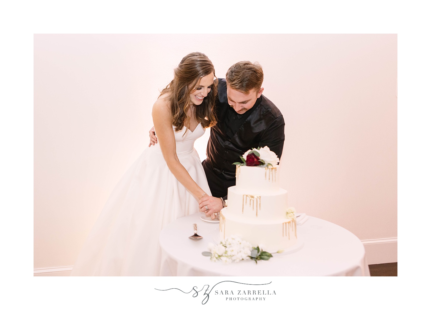 newlyweds cut wedding cake during wedding reception 