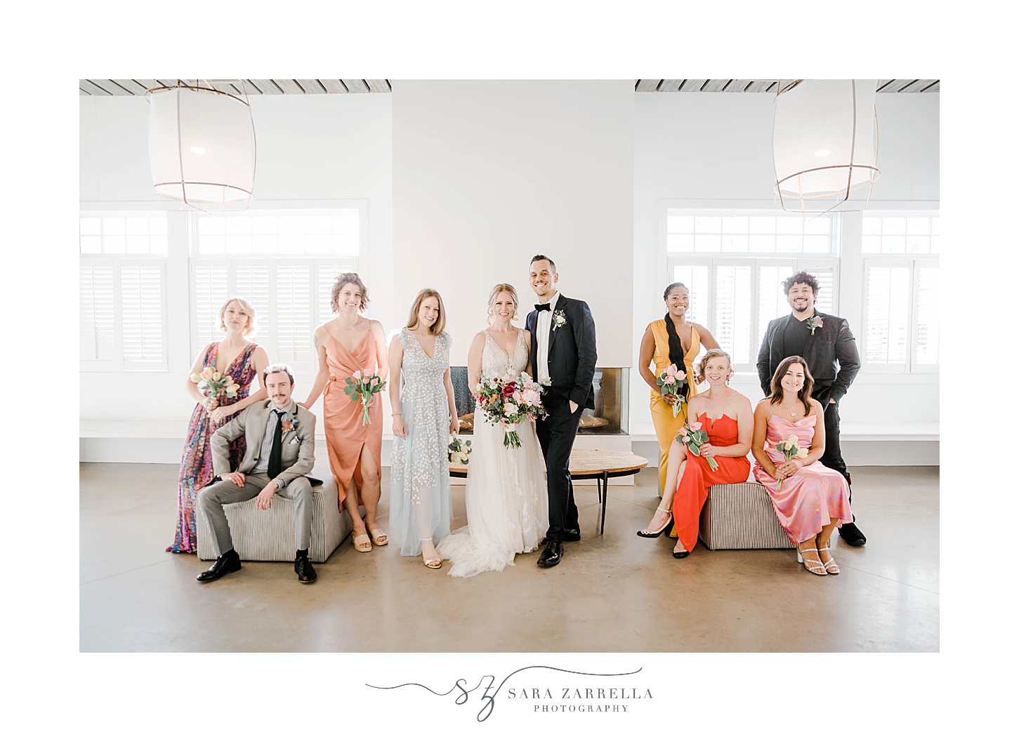 bride and groom stand with wedding party at Newport Beach House