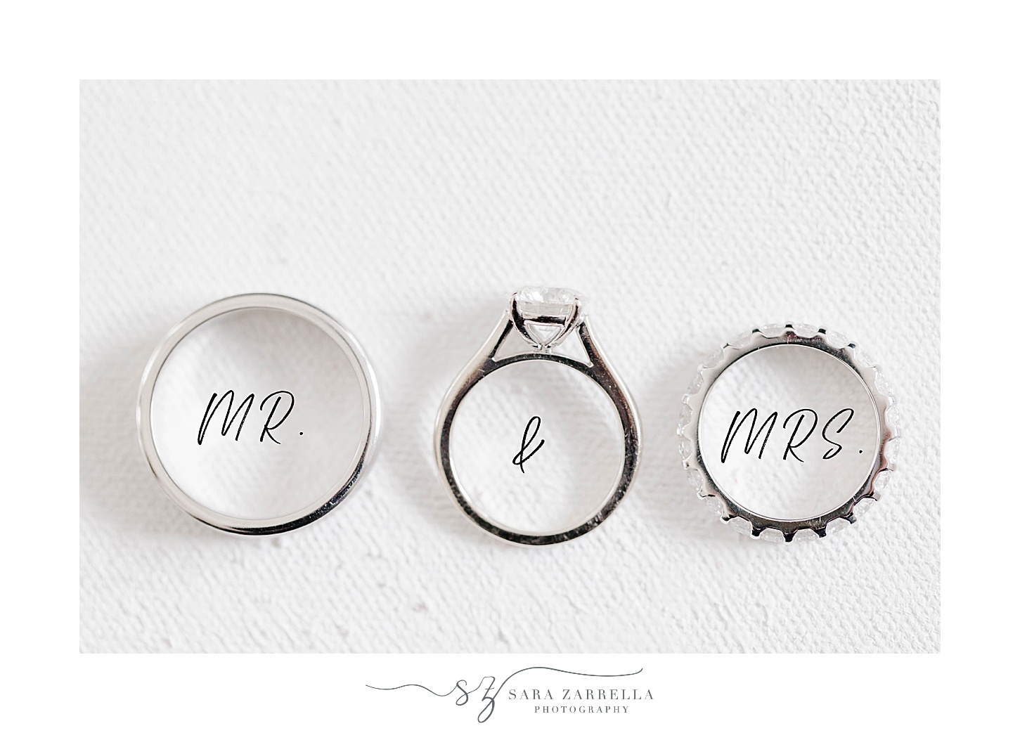 wedding bands on Mr. and Mrs. writing