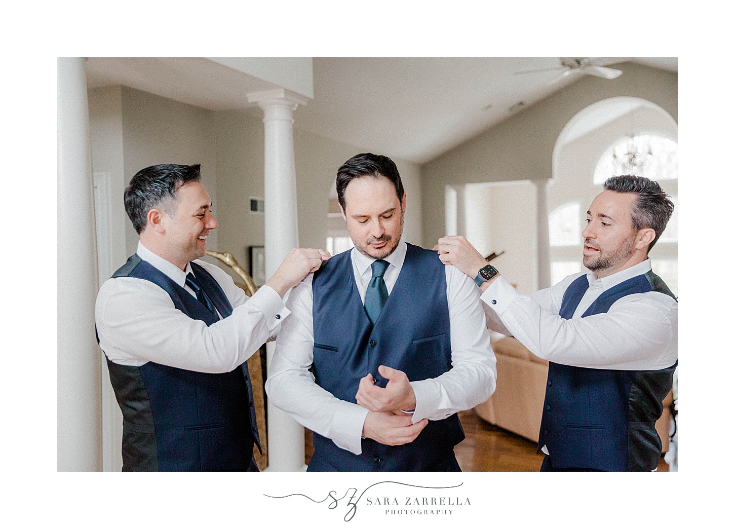 groomsmen help groom prepare for RI wedding