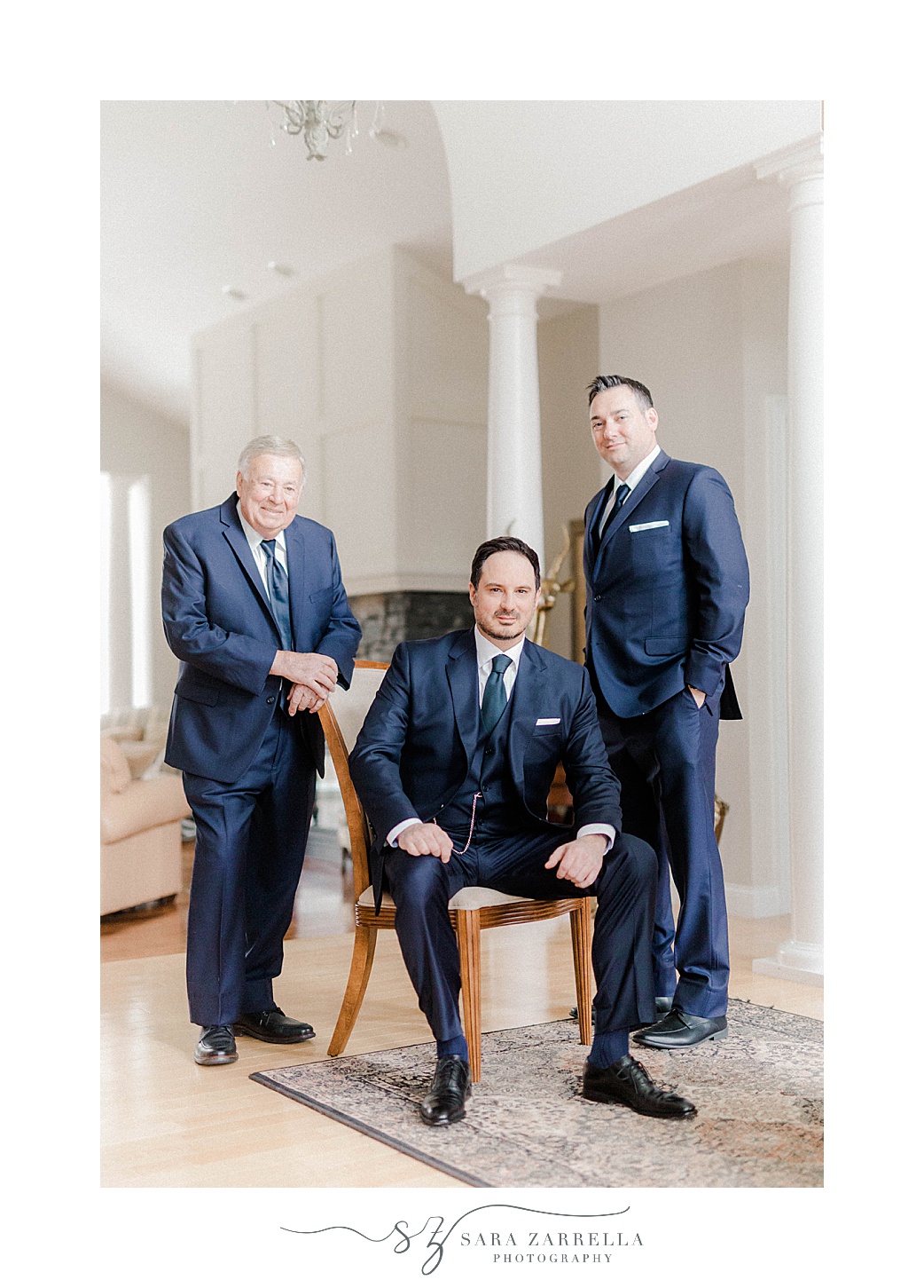 groom poses with dad and brother