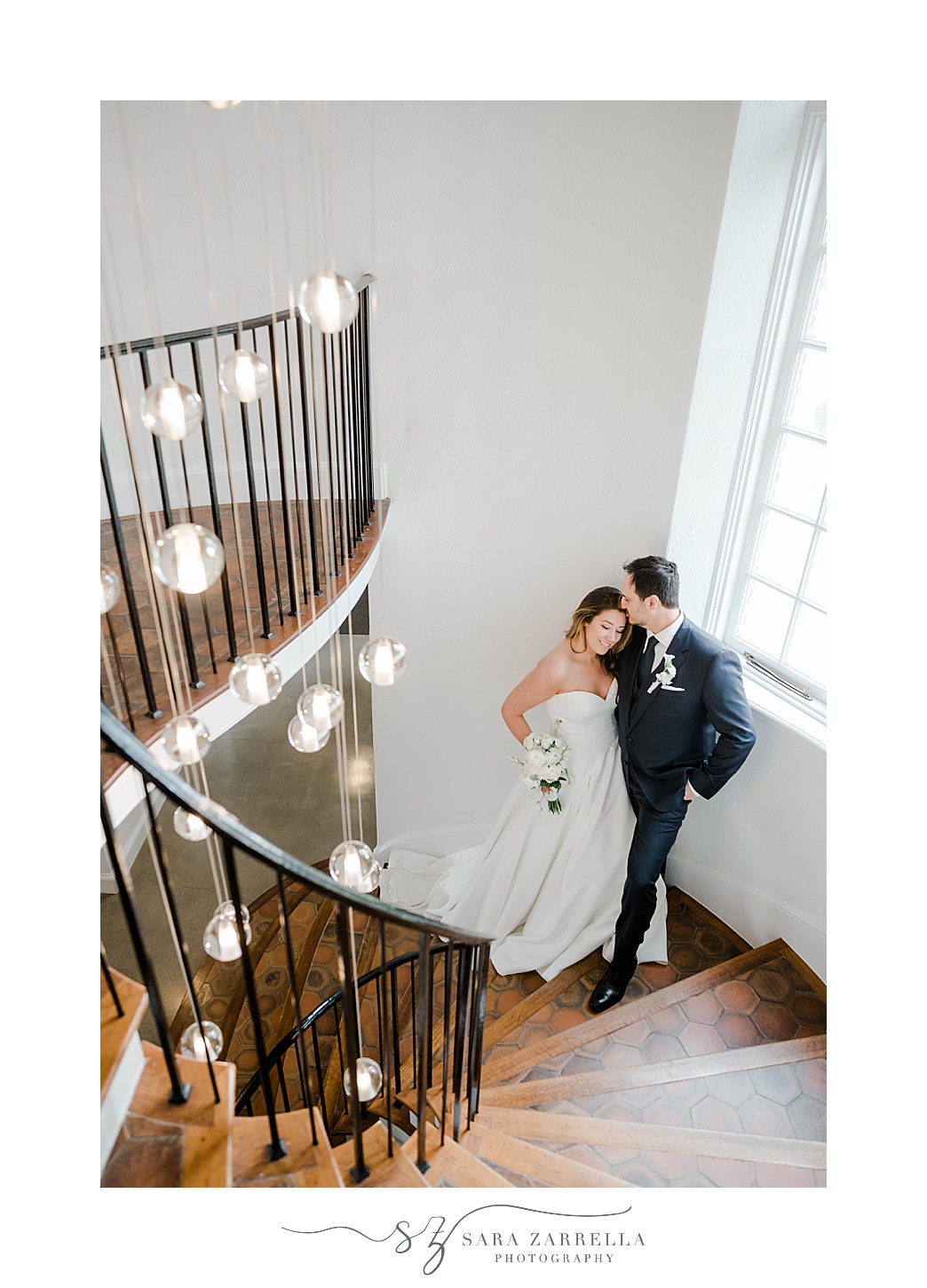 romantic wedding portrait on staircase at Shepard's Run with hanging bulbs