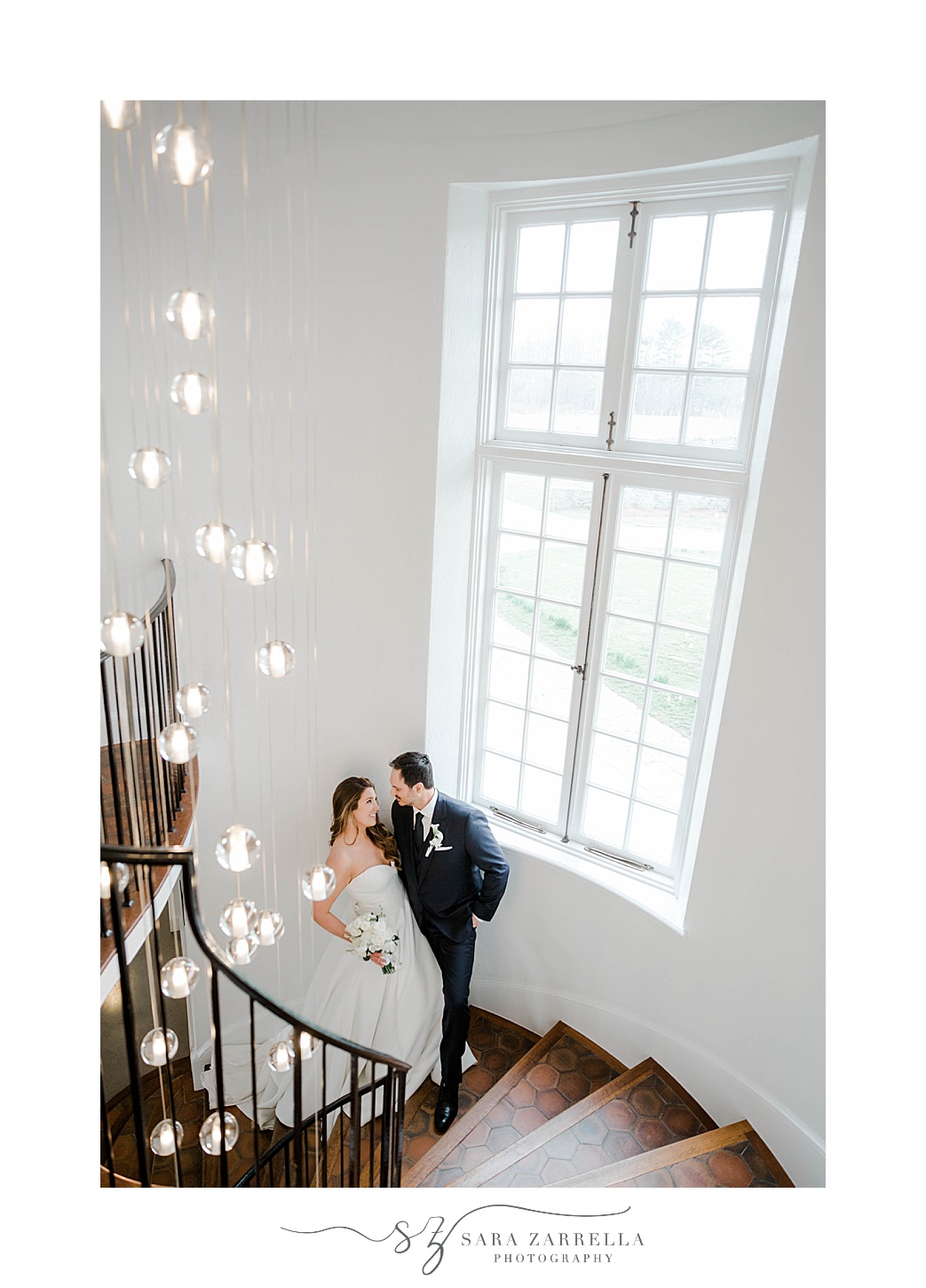 bride and groom pose on staircase inside Shepard's Run