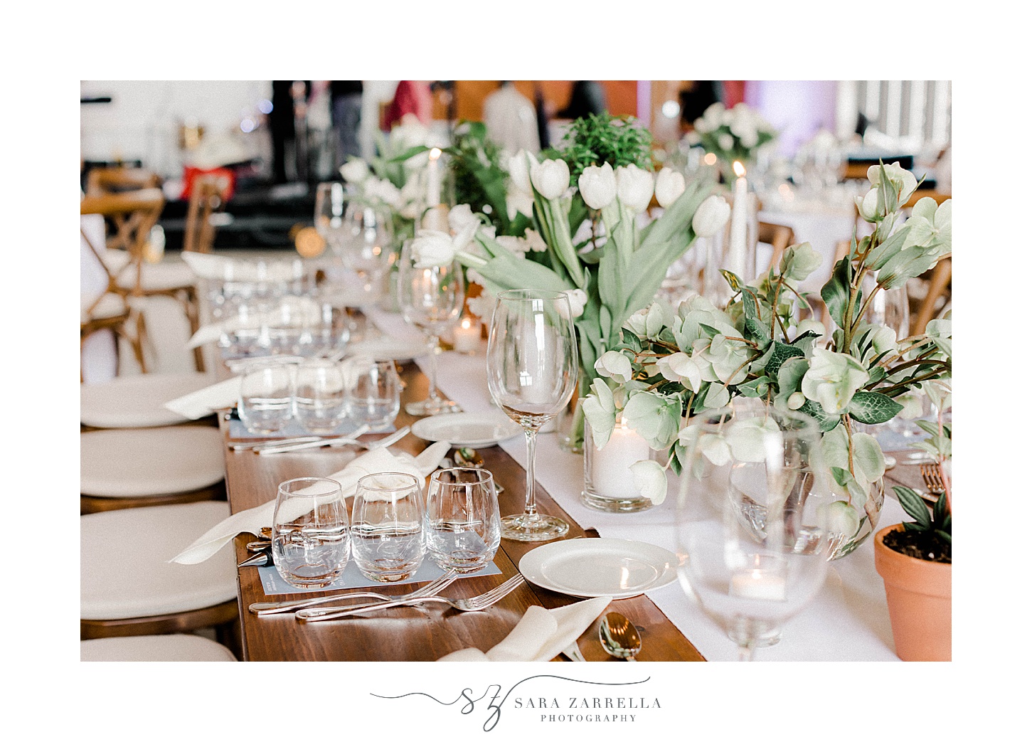 place settings with green and white plants in center