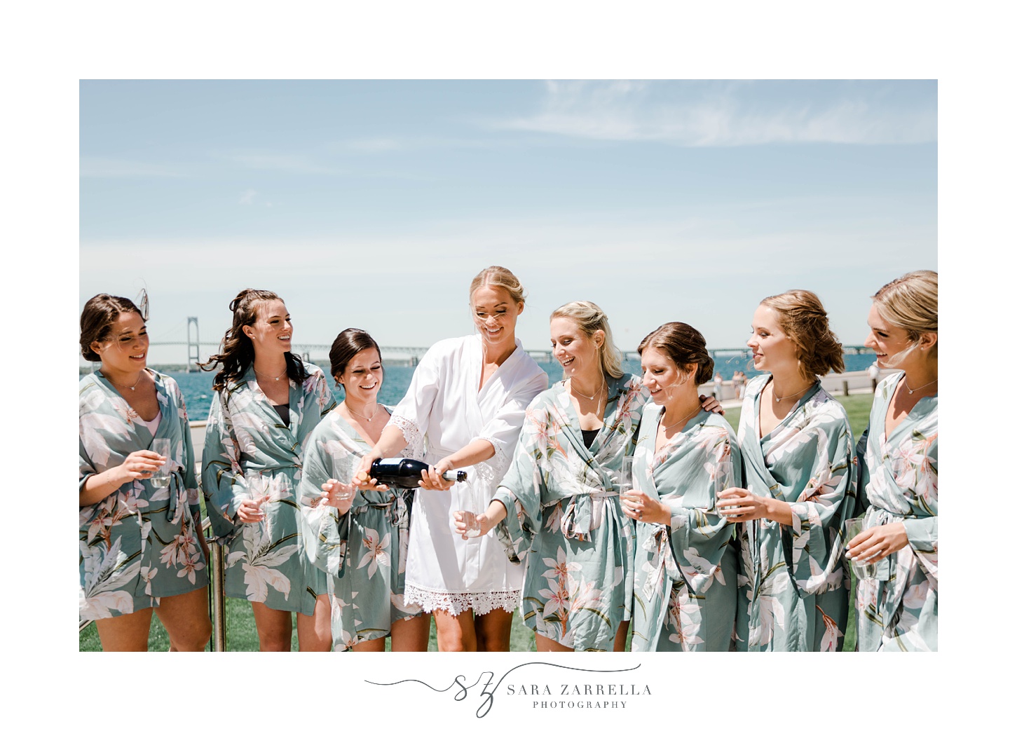 bride and bridesmaids pop champagne at Gurney's Resort