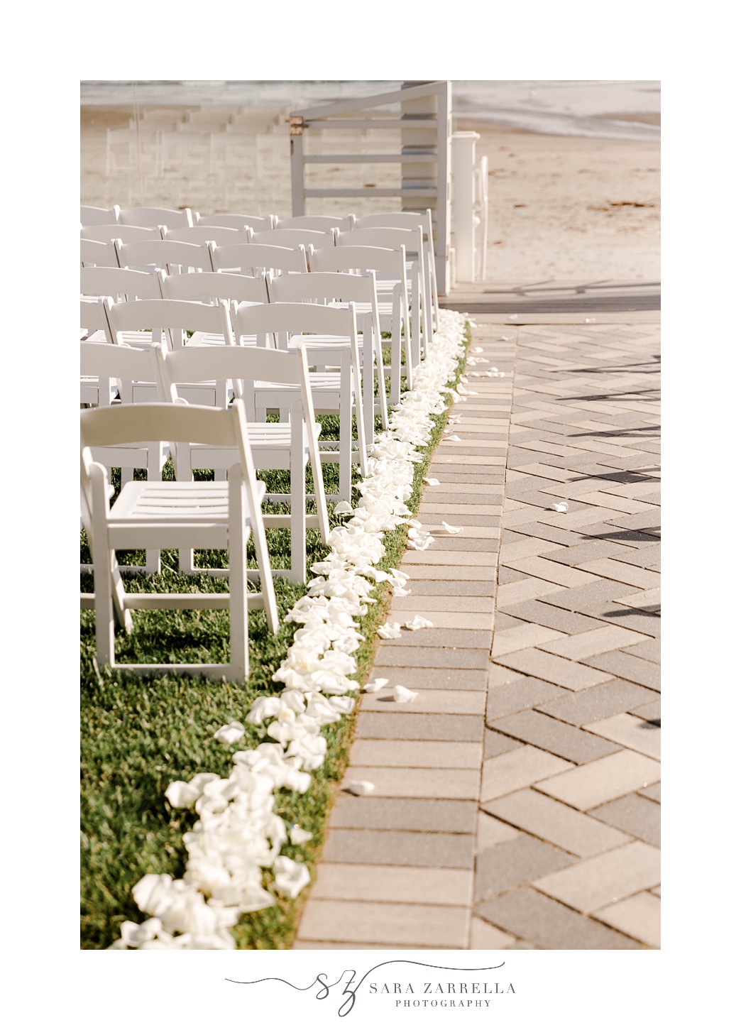 white flower petals line aisle at Newport Beach House
