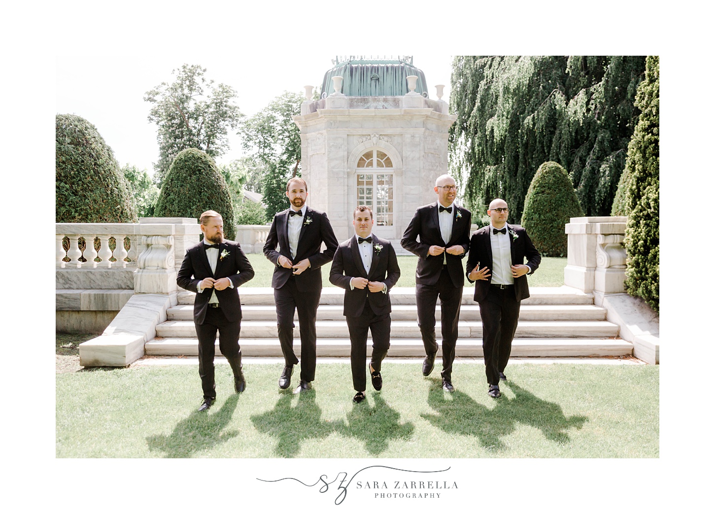 groom and groomsmen walk down steps at The Elms 