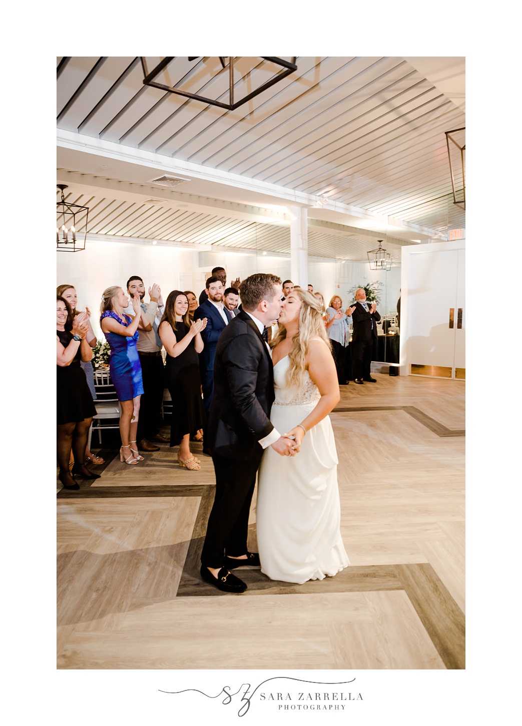 newlyweds kiss during Newport RI wedding reception