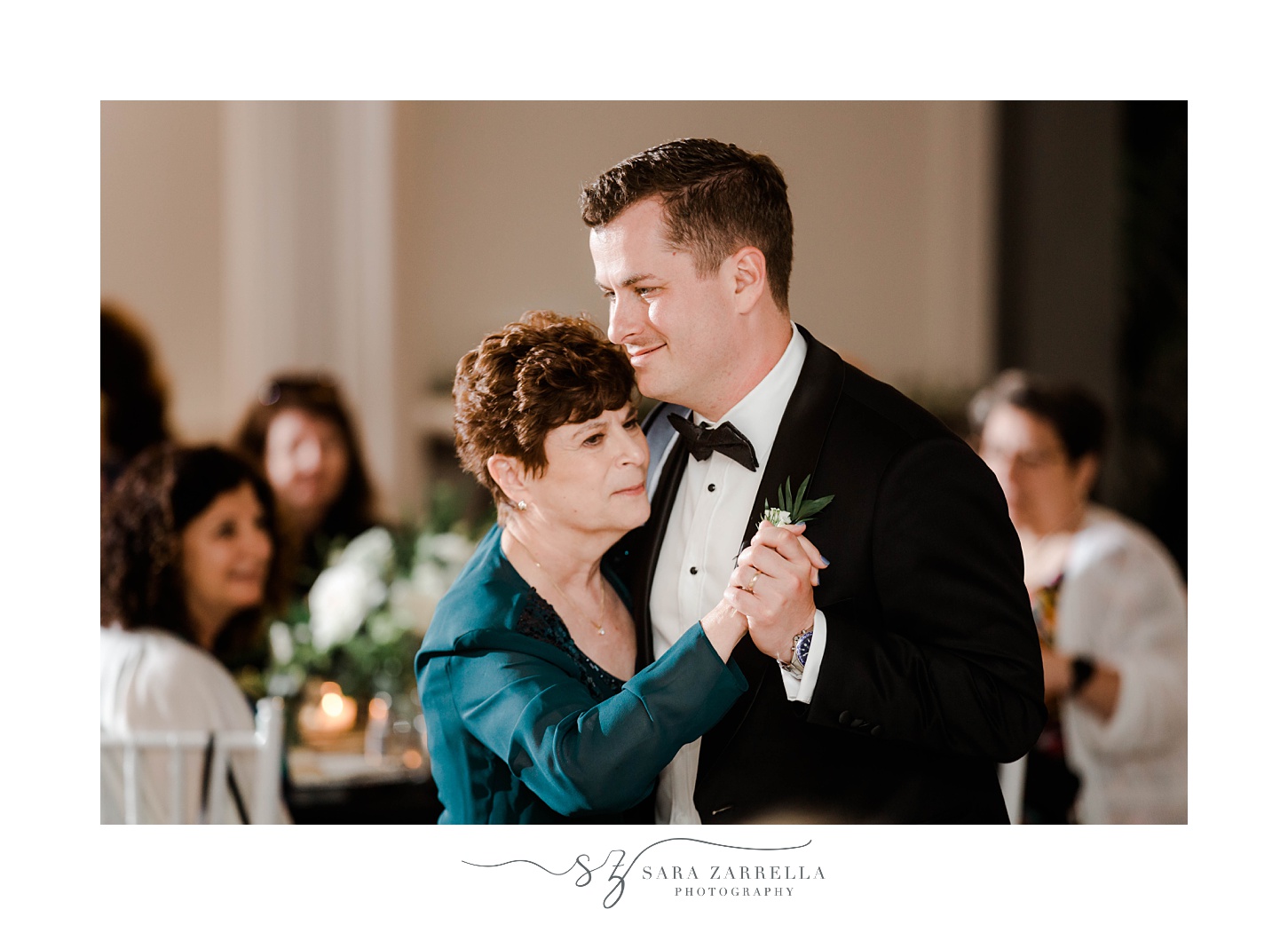 groom dances with mom in teal gown