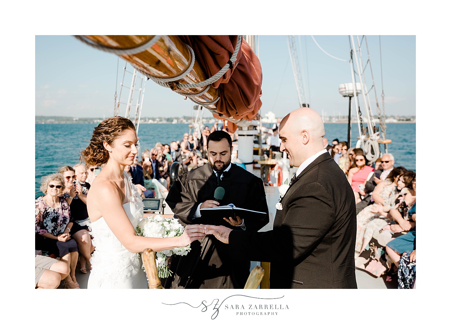 newlyweds exchange vows during schooner Aurora ceremony