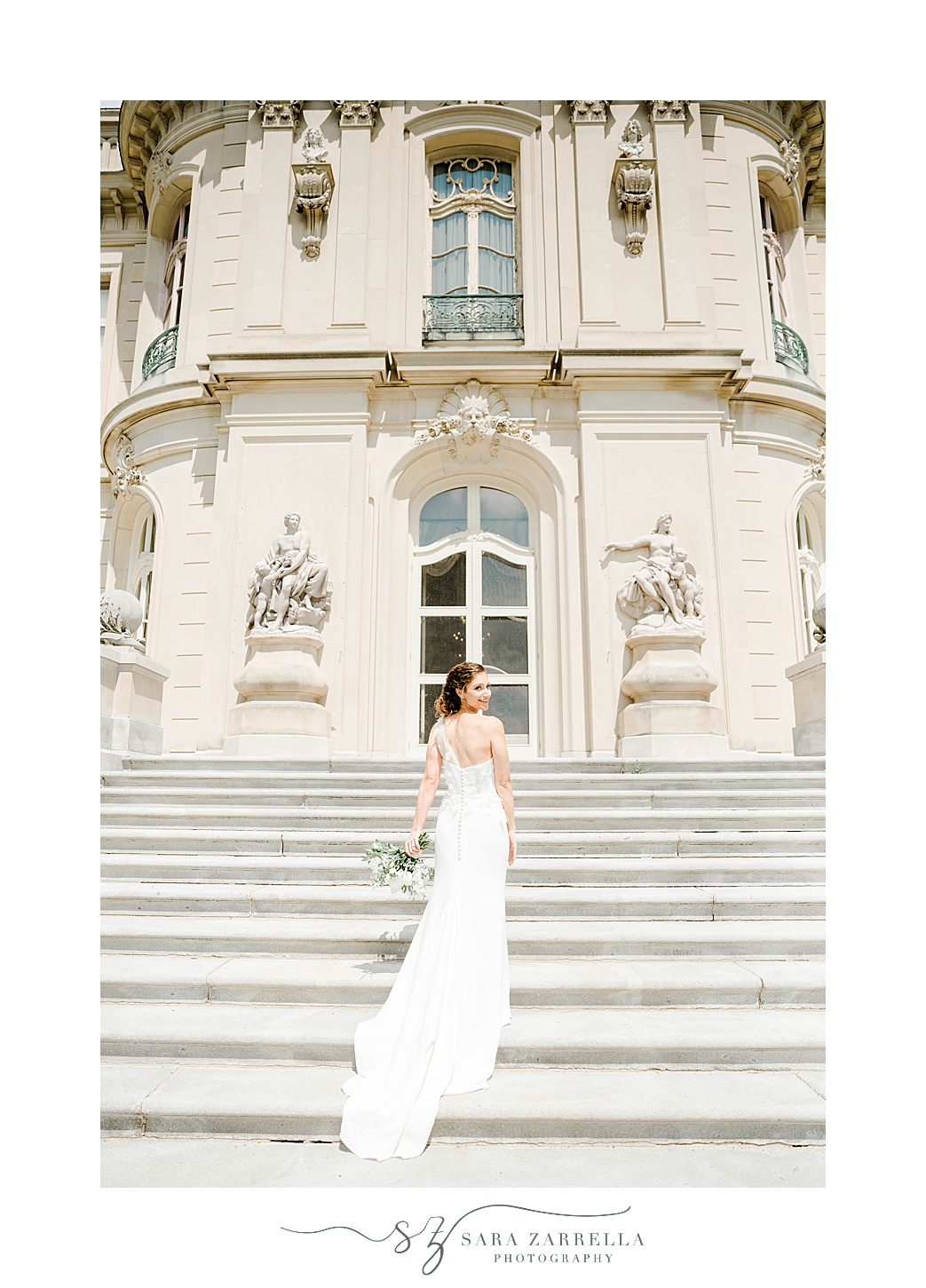 bride walks up steps at The Elms in one shoulder wedding gown