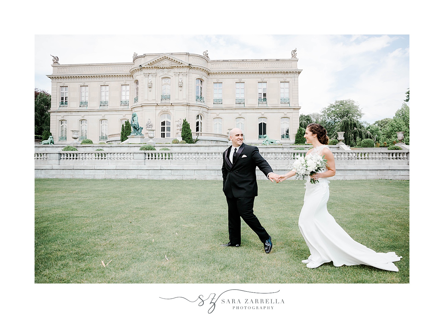 bride and groom hold hands walking across the lawn at The Elms 