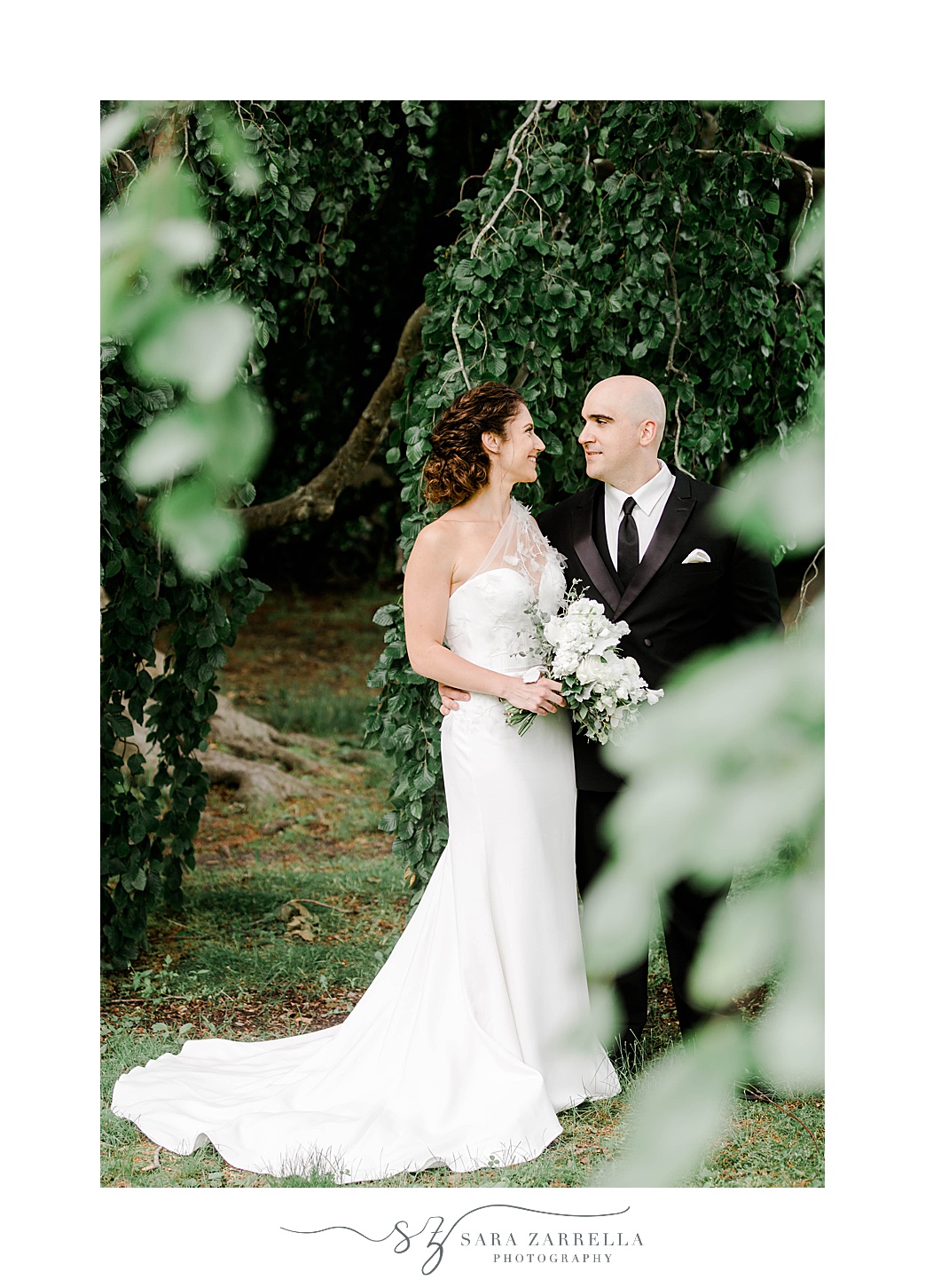 bride and groom pose among trees at The Elms