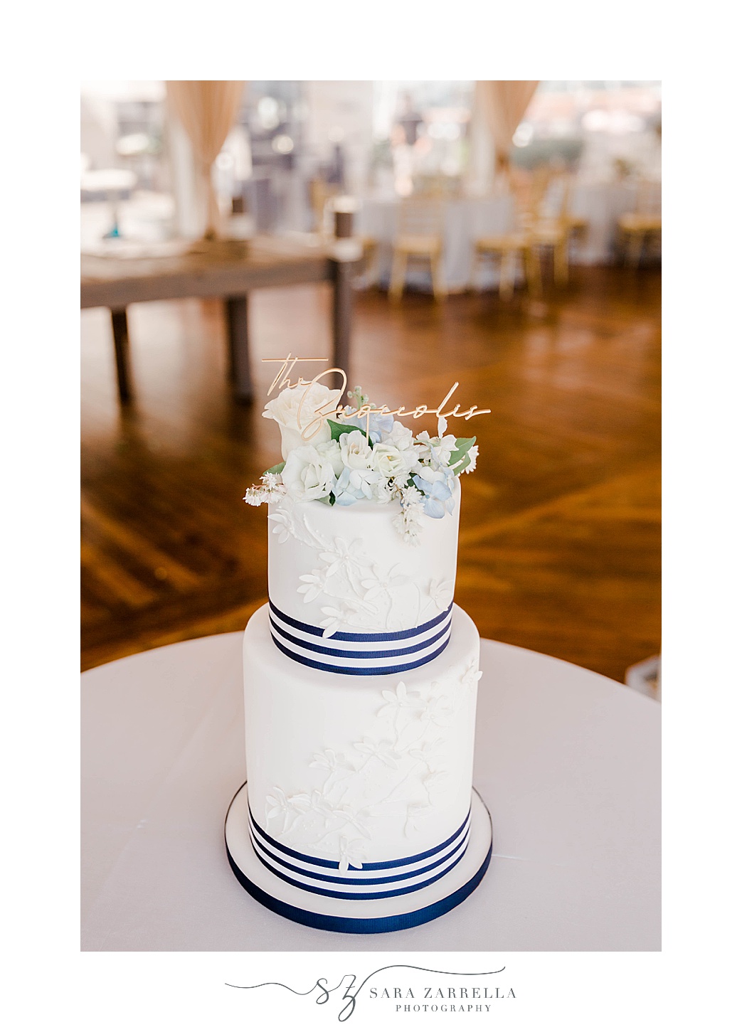 tiered wedding cake with white and blue nautical details