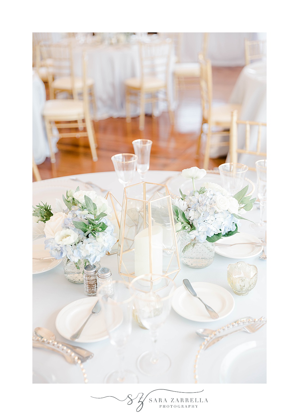 centerpieces with white flowers at Regatta Place wedding reception 