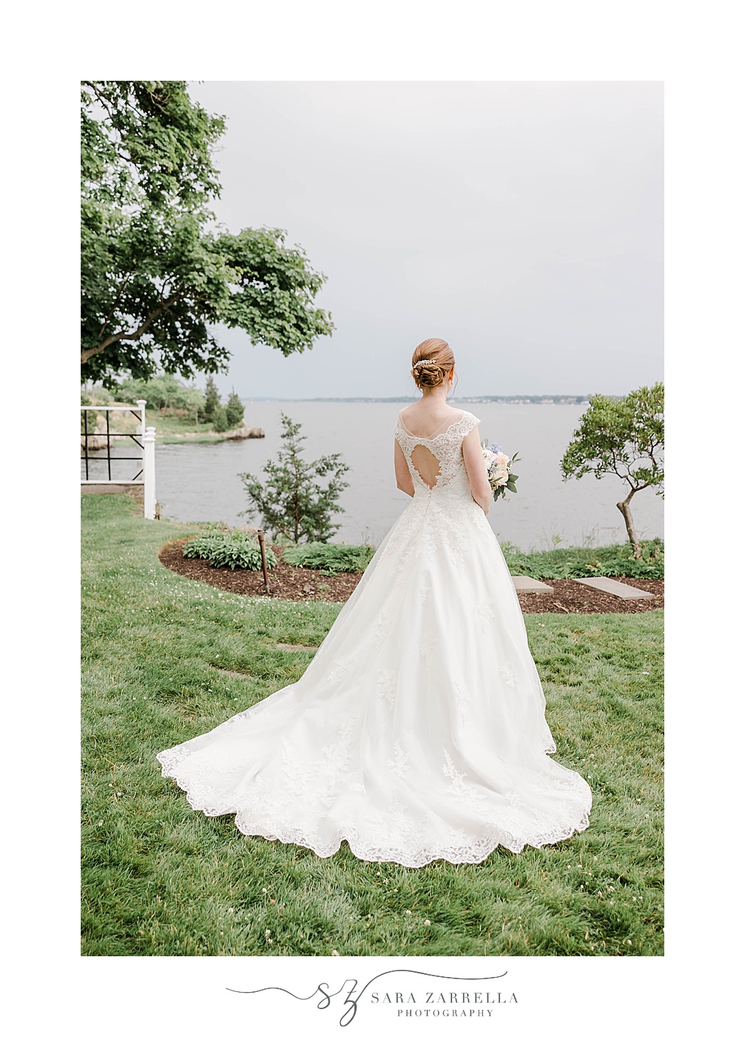 bride shows off back of wedding gown at Squantum Association