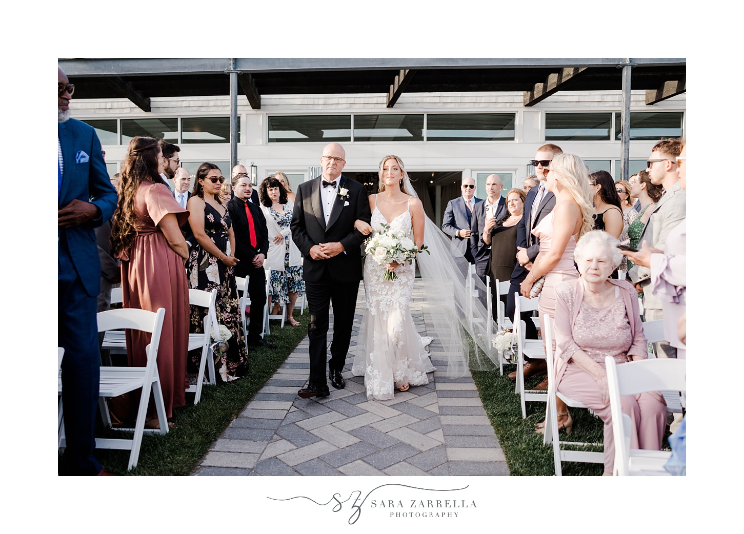 bride walks down aisle with father at Newport Beach House