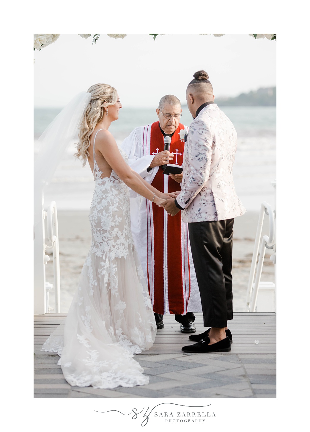 groom and bride exchange vows during outdoor ceremony at Newport Beach House
