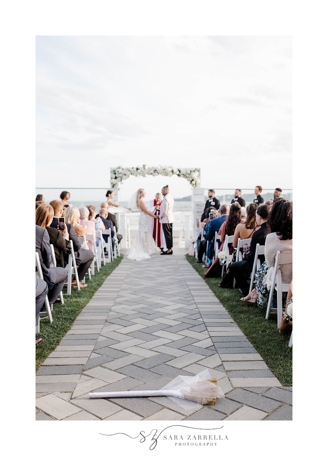 newlyweds exchange vows during waterfront ceremony at Newport Beach House