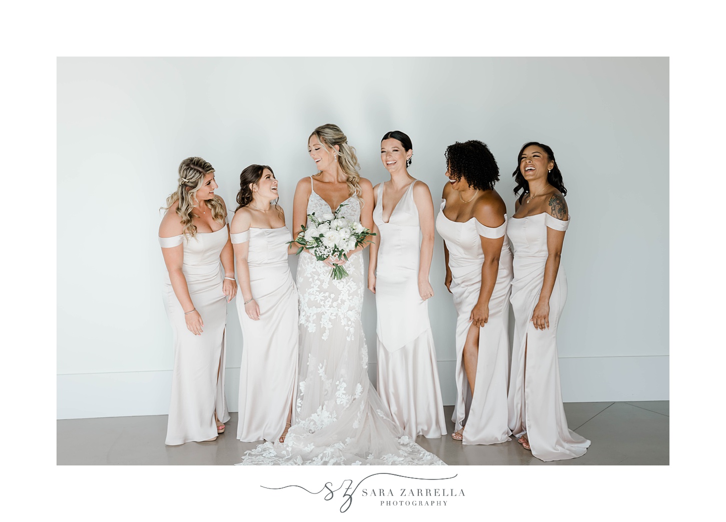 bride stands with bridesmaids inside Newport Beach House