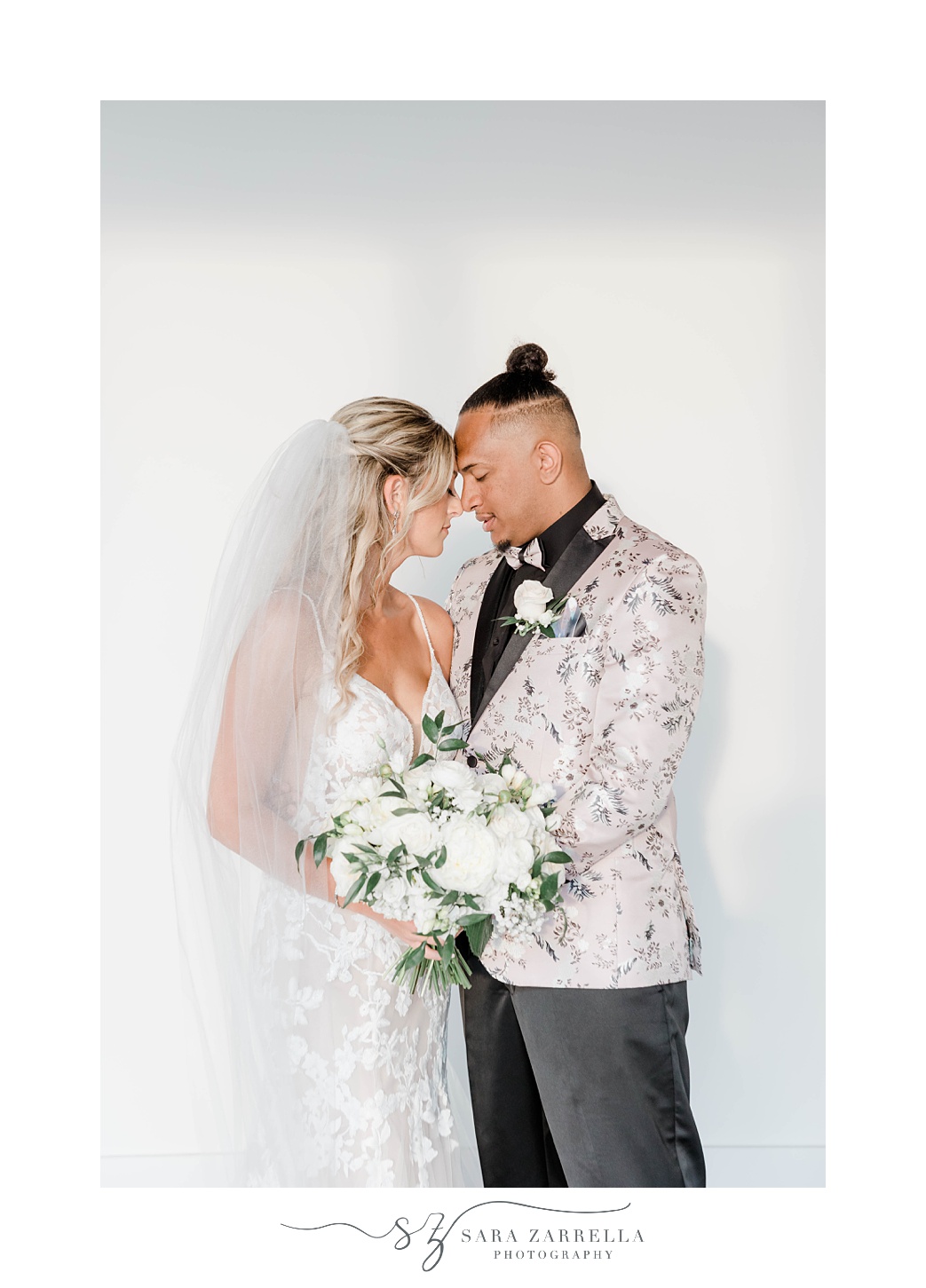 groom leans forehead into bride inside Newport Beach HOuse