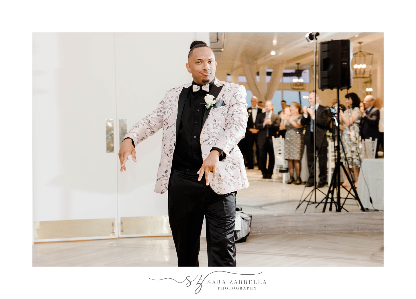 groom dances into Newport RI wedding reception