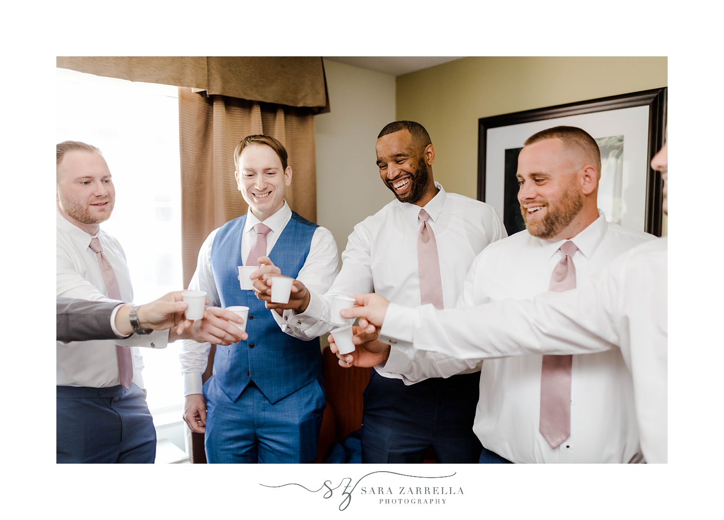 groom and groomsmen toast before wedding in Rhode Island 
