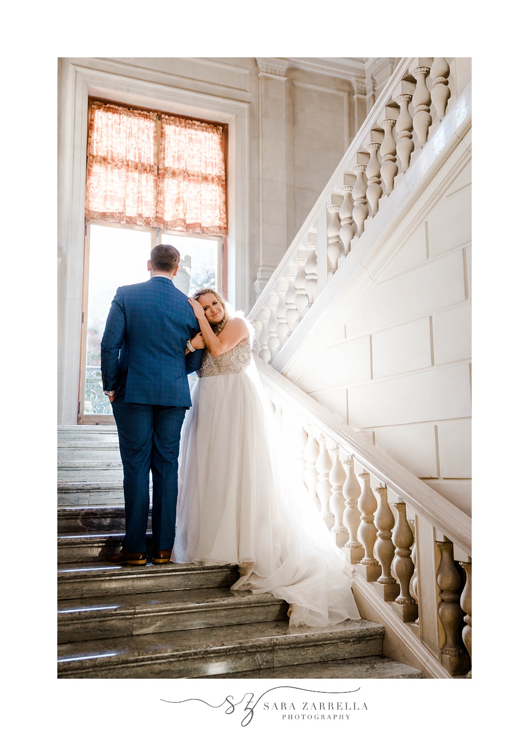 bride leans head on groom's shoulder on steps at Aldrich Mansion
