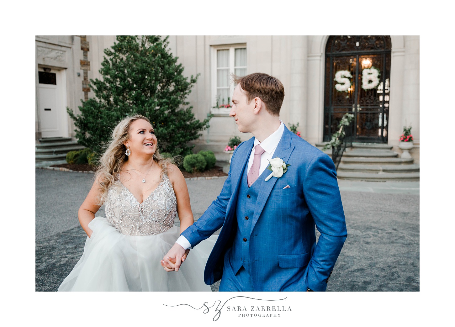 bride and groom laugh together during portraits on driveway of Aldrich Mansion