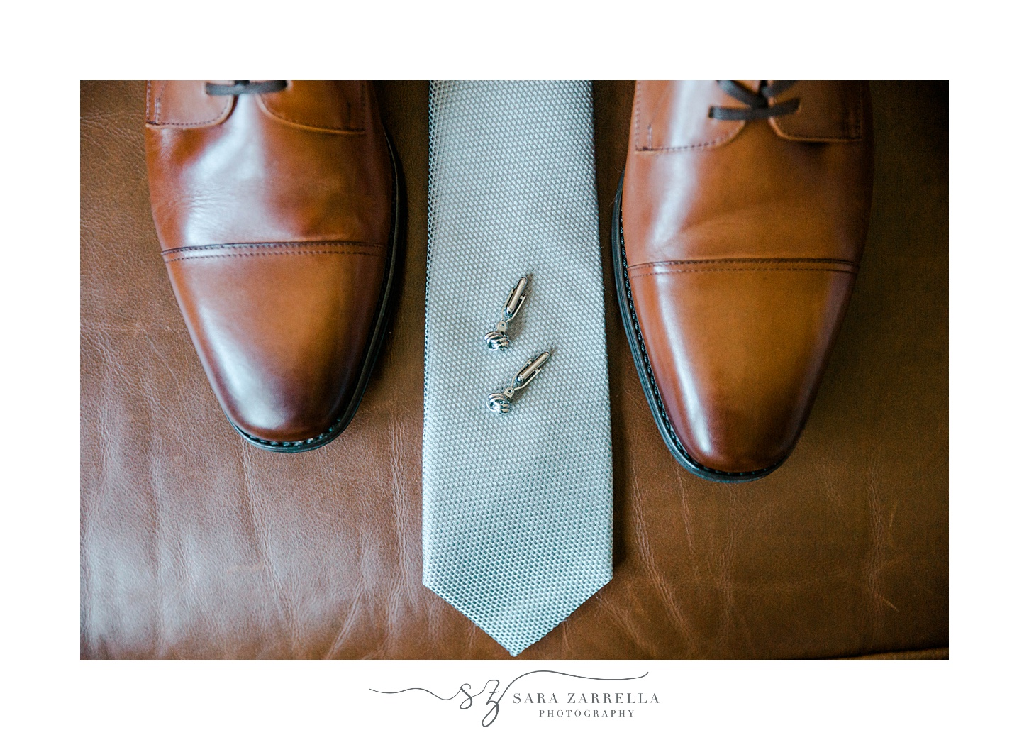 groom's blue tie and brown shoes